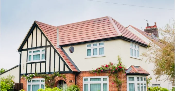 Red clay tile re-roof on a Tudor style detached house